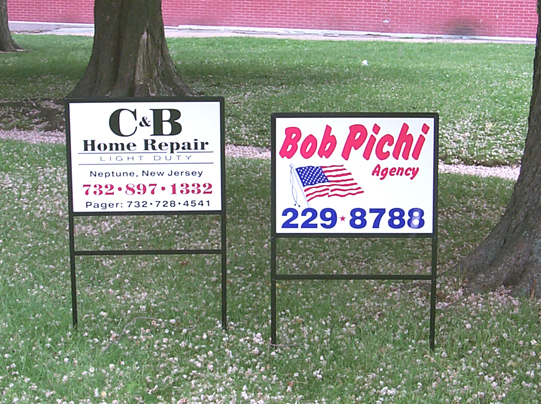 Photo of two 18x24 real estate style signs in black iron frames. File name=
rs002.jpg (309144 bytes)